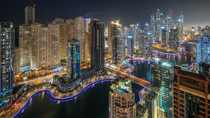 Fototapeta na wymiar View of various skyscrapers in tallest recidential block in Dubai Marina aerial night timelapse