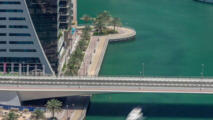 Dubai Marina waterfront and city promenade timelapse from above.
