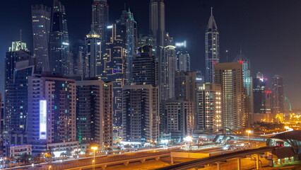 Obraz na płótnie Canvas Dubai marina tallest block of skyscrapers all night timelapse.