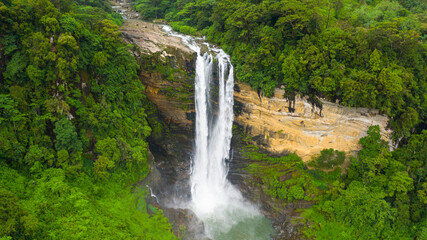 Fototapeta na wymiar Beautiful waterfall in the rainforest. LaxapanaFalls, Sri Lanka.