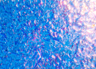 Spacey abstract holographic water liquid background with iridescent effects in blue, pink, and...