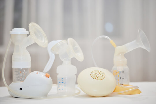 different breast pumps on table. Maternity and child care.