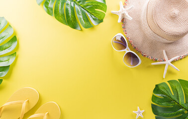 Summer composition concept made from starfish, beach hat, flip flop and monstera leaf on pastel...
