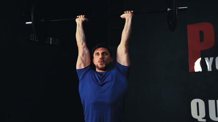 Fototapeta premium Sportsman workout bodybuilding exercise with barbells pumping muscle, healthy people lifestyle in the fitness gym concept.