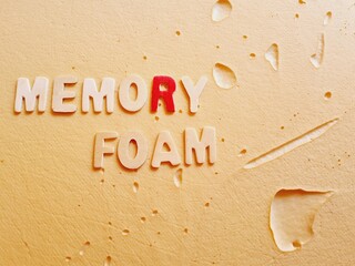 memory foam written on a latex surface
