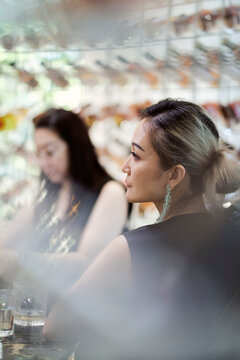 Two Asian Fashion Women Sitting In Whisky Bar Enjoying Time