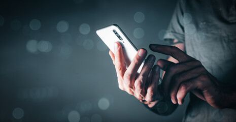 a man holding a phone in his hands