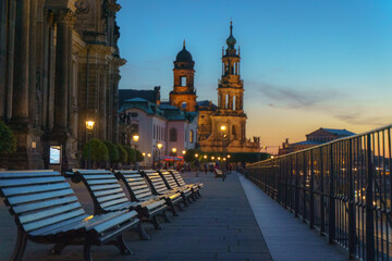 Fototapeta na wymiar Promenade of Dresden in a sunset with bench and church, sky on the background