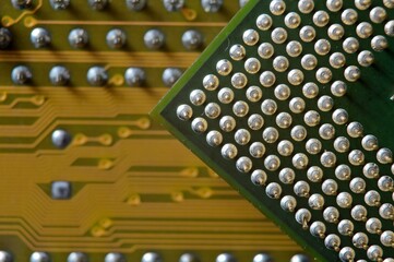 microprocessor on the background of the microcircuit of the motherboard
