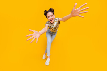 Photo of sweet pretty lady dressed print t-shirt dancing open arms catching you isolated yellow color background