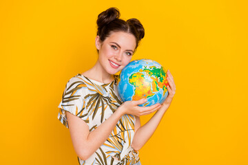 Photo of shiny cute lady dressed print t-shirt taking care about our planet isolated yellow color...