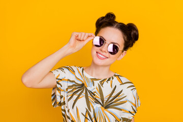 Photo of funny adorable woman wear print t-shirt arms dark spectacles isolated yellow color background