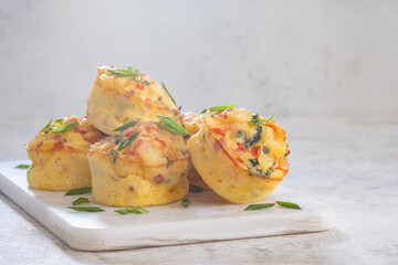 Delicious egg muffins with ham, cheese and vegetables