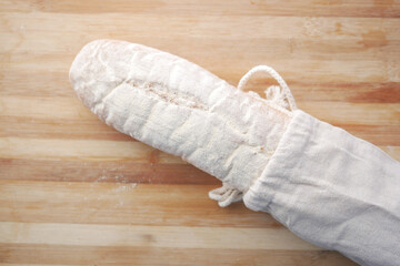 baked bread stored in a reusable linen bag . Eco friendly Zero waste concept..