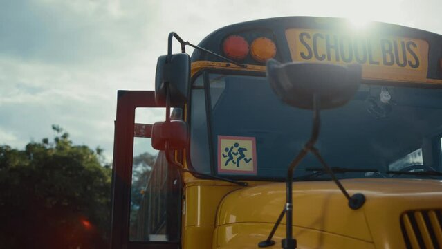 School bus sign image running children closeup. Pupils safety vehicle on parking