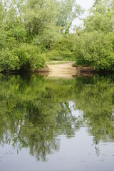 Fototapeta na wymiar Lake views in Milton Country Park, Cambridge, June 2022