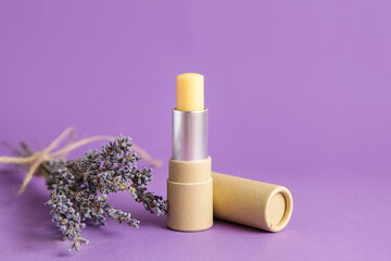 Natural kraft paper cosmetic tube. Mockup. Lavender Cosmetics. Open lip balm package on lavander violet background - obrazy, fototapety, plakaty