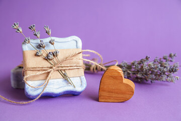 Handmade natural bath spa lavender soap on violet background. Soap making. Soap bars. Spa, skin care. Gift wrapping.