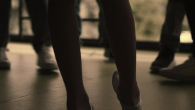 Closeup children legs standing group on hallway. Bullies group pushing outcast.