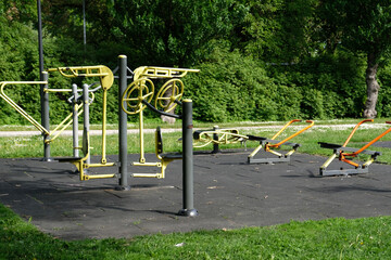 Fototapeta premium Urban sports ground with weight training and exercise equipment for sports. Sports and recreation area. Empty sports ground outdoor workout in a park.