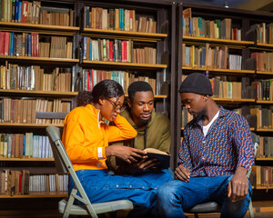 happy young university students studying with books in library.