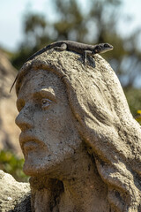 lizard on top of a sculpture in the city of Caeté, State of Minas Gerais, Brazil