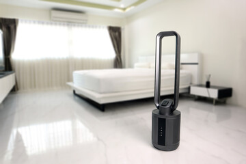 modern design black color bladeless purifying tower fan is on the floor of the nice white bedroom...