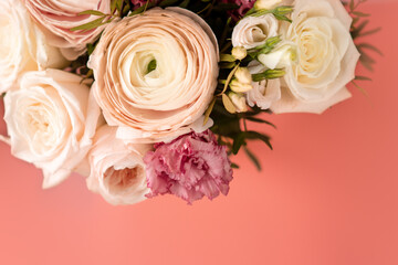 Bright pink flowers bouquet closeup. Roses and orchids wallpaper. Beautiful background for a Birthday, International Female Day, or Saint Valentine. The festive backdrop for a postcard design