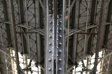 Metal arched frame construction of the old railway station in Europe