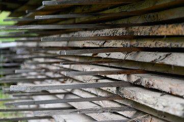 Lots of boards. Boards are stacked. Building materials. Warehouse of wooden products.
