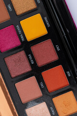 Partial section of a used make-up box in portrait format