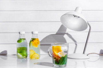 Cooling cocktail with orange, passionfruit, mint and ice