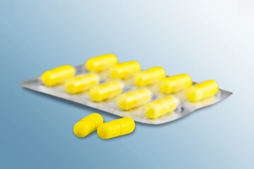 White blister tablets on pastel background