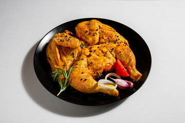 Raw marinated chicken with vegetables