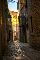 Fototapeta na wymiar Empty morning streets in mediteranean historical city Trogir in Croatia