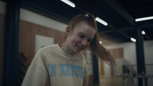 Happy school girl playing table foosball closeup. Teen child win in soccer game.