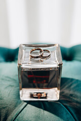 Elegant wedding rings are made of gold. Close-up, macro. Light background
