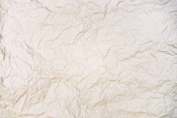 Beige crumpled paper texture background. Old grunge white paper backdrop. Wrinkled paper. Copy space for text, design art work.