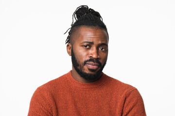 Sad depressed frustrated young african-american man looking at camera with negative feelings thoughts being disappointed offended isolated in white background