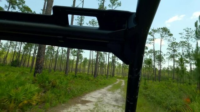Driving side by side sxs on off road trails with mud water splash
