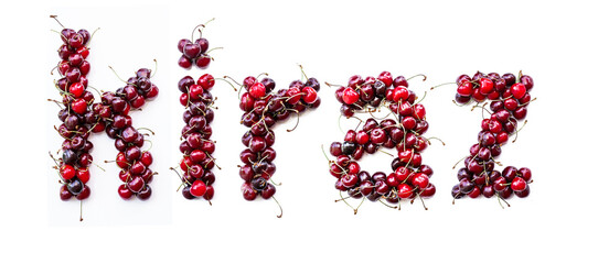 Sweet cherry - a sweet inscription from the berries of ripe cherries in Turkish kiraz. Isolate on a white background, ready-made inscription for design and layout. Great gift and tasty treat