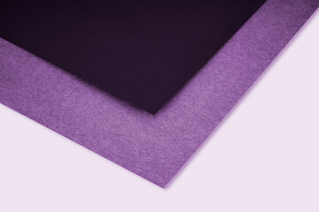 Dark and light abstract purple background with lines forming triangle looks like side view of an open book plain vs textured cover