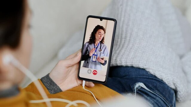 Sick woman doing video call with doctor