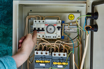 Analog time switch for controlling boiler and heating on real-time located inside electrical board.
