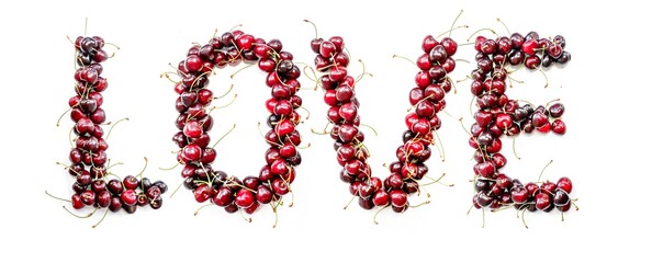 Love - a sweet inscription from the berries of ripe cherries in English. Isolate on a white background, ready-made inscription for design and layout. Great gift and tasty treat