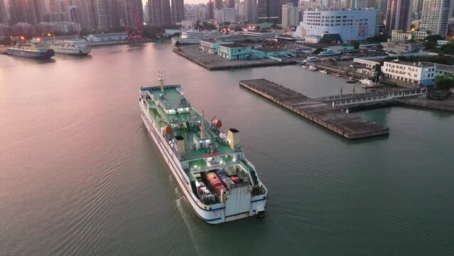 Passenger Ship Arriving at Haikou Port Terminal during Sunrise, the Main Transportation Hub for the Pilot Free Trade Zone and Free Trade Port in Haikou City, Hainan Province, China, Asia.