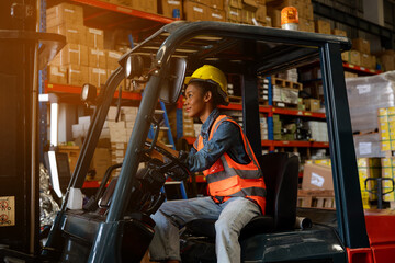 Portrait of African women forklift driver in factory, Woman cargo worker work in warehouse.