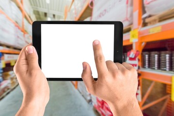 Building Inventory management concept. Man using digital tablet, showing warehouse software management dashboard on warehouse