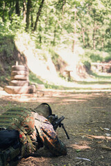 Shoot at a target from a assault rifle in a prone position