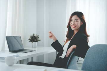 Asian woman working on customer documents, finance, accounting, taxes in the office.